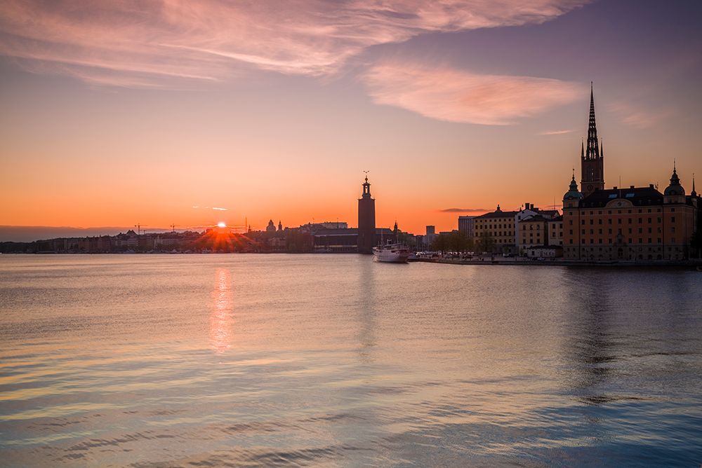 Sweden-Stockholm-Stockholm City Hall and Riddarholmen church-sunset